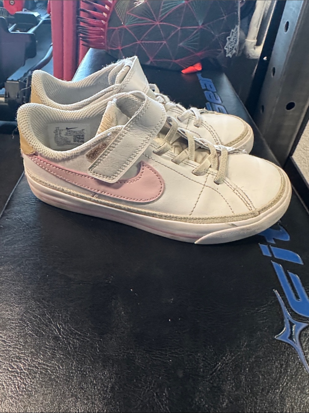 Nike Kids White Sneaker with Pink Swoosh and Gold Heel